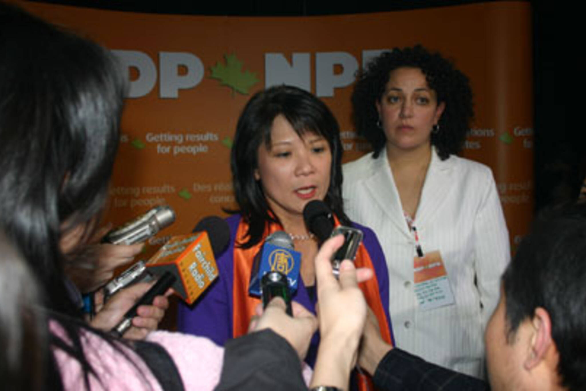 Newly minted MP Olivia Chow jumps into a press scrum after her victory was announced