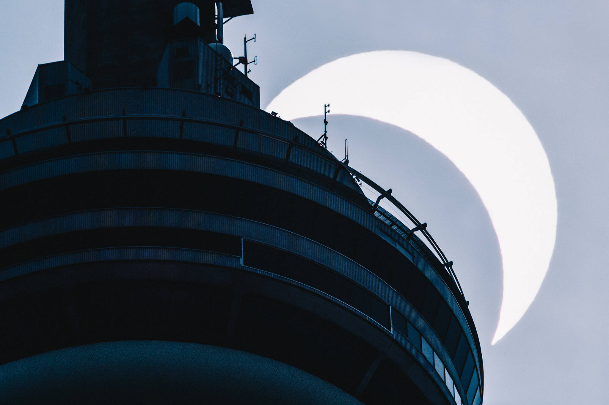 Someone captured the solar eclipse passing the CN Tower