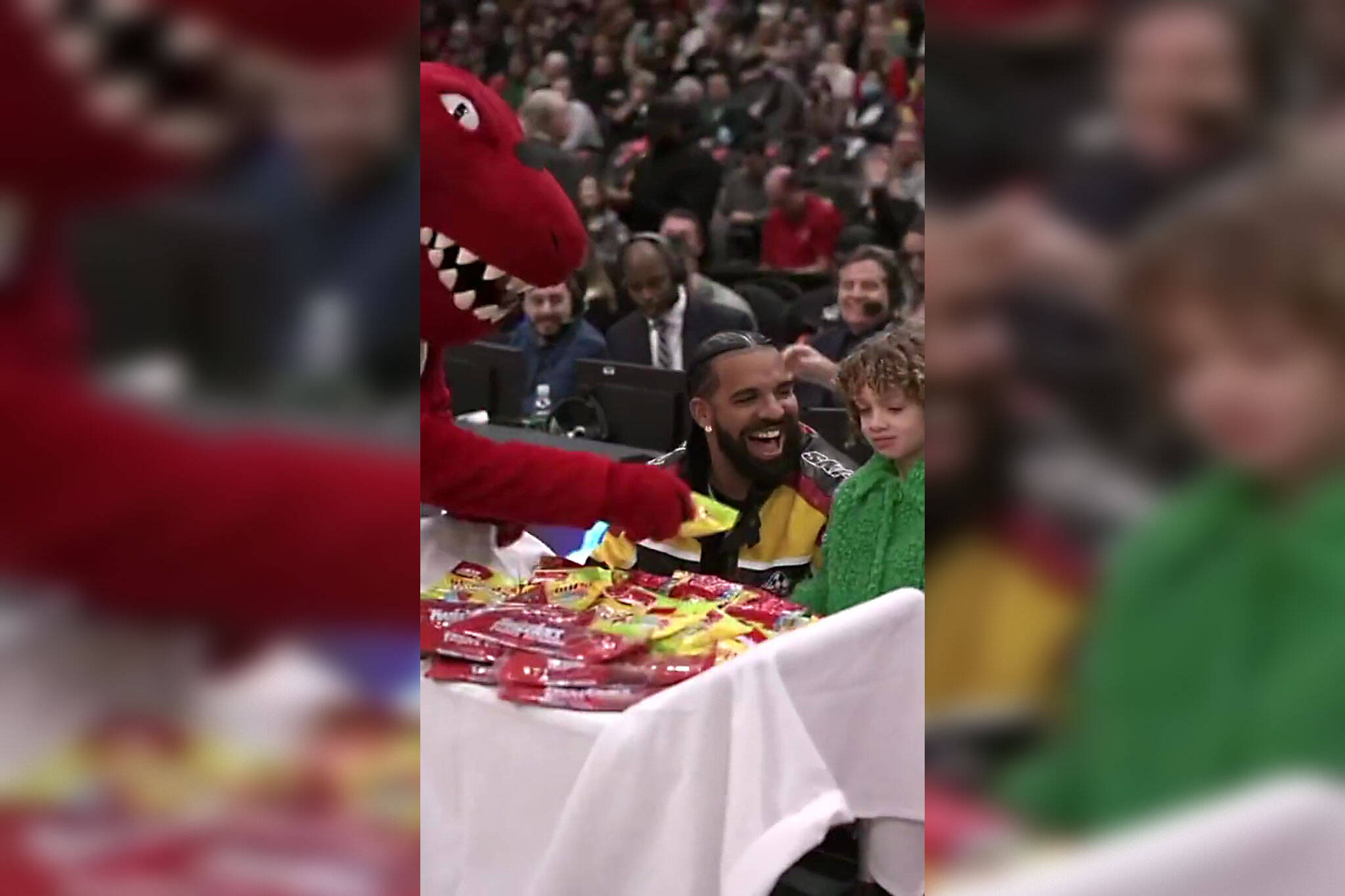 Drake's Son Adonis Snacks on Skittles While Watching Raptors Game with Dad  from Courtside Perch