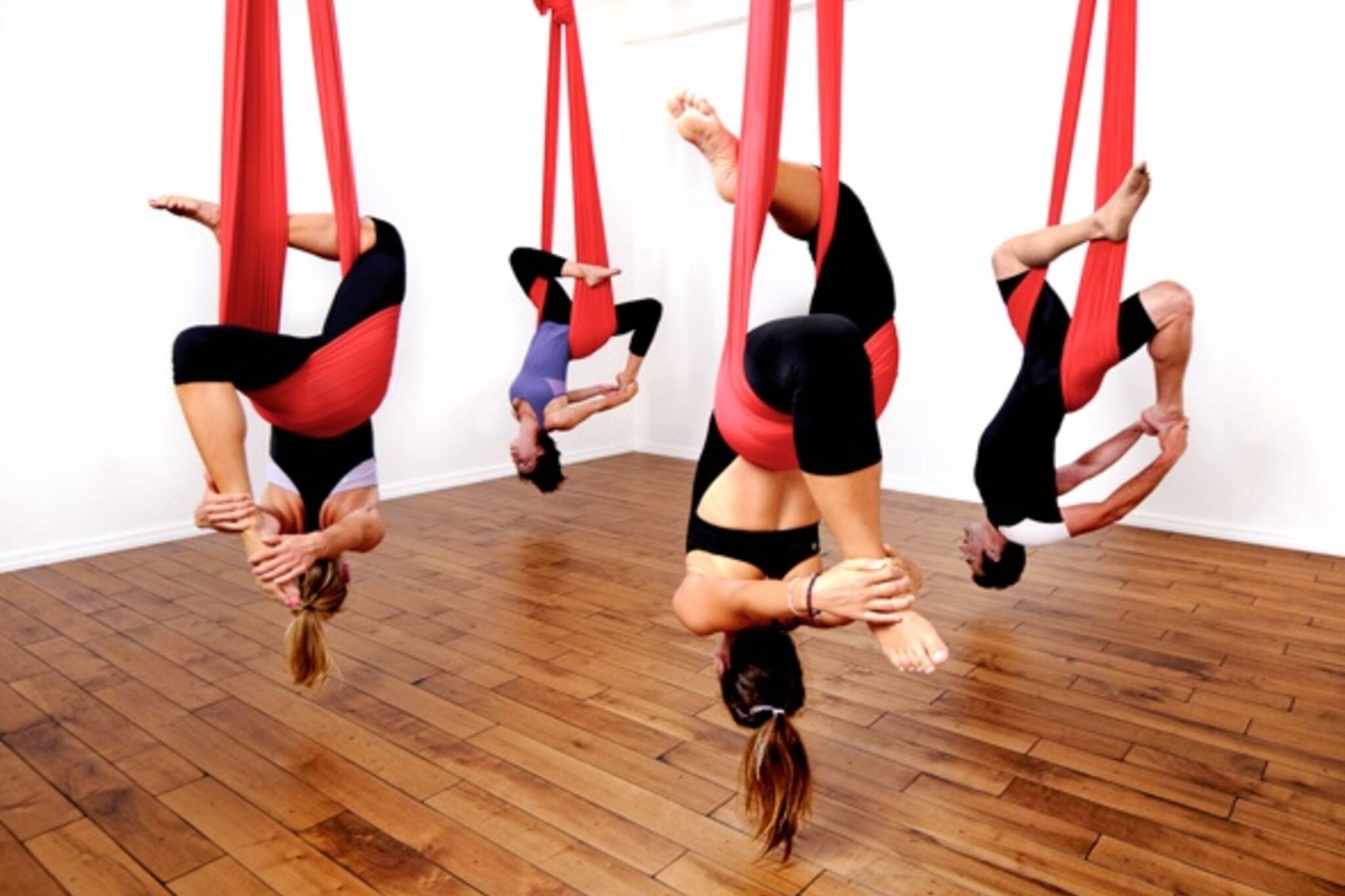 https://media.blogto.com/articles/4301-20110117-aerialyoga.jpg?w=2048&cmd=resize_then_crop&height=1365&quality=70
