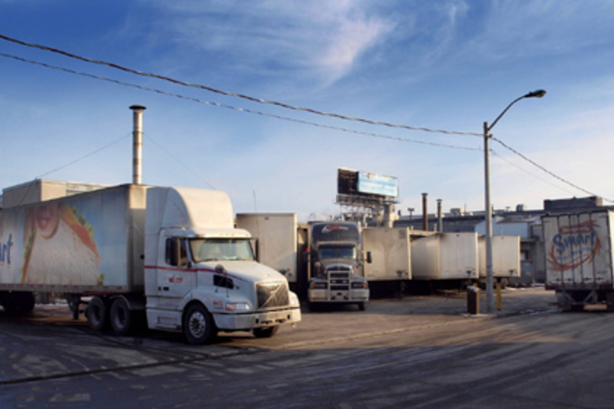 Trucks parked outside Canada Bread on Fraser