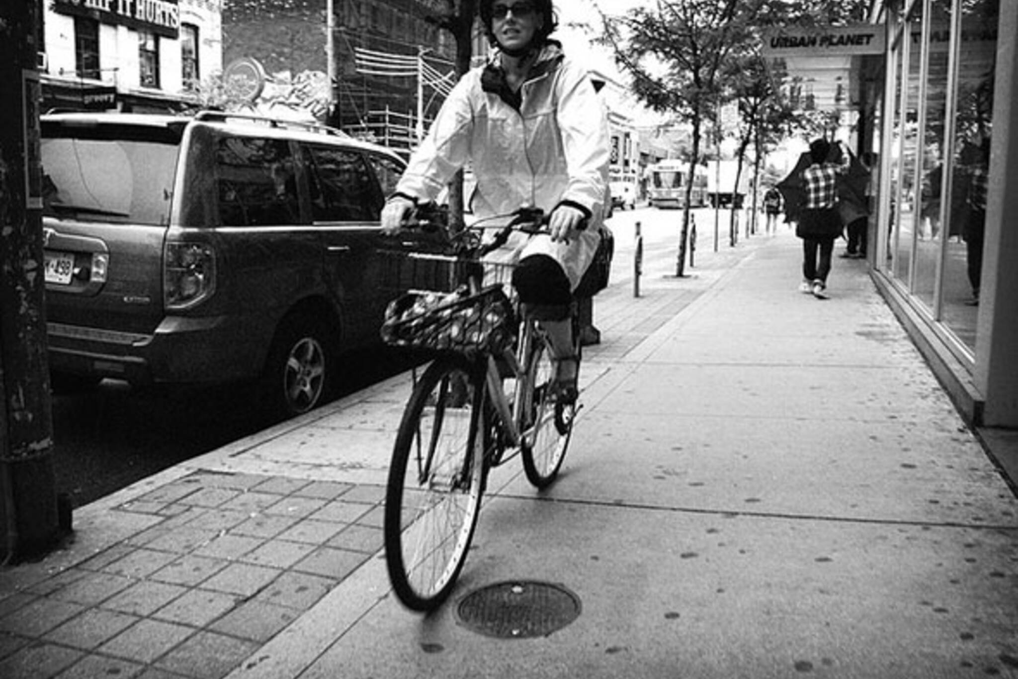 toronto cyclist riding on the sidewalk