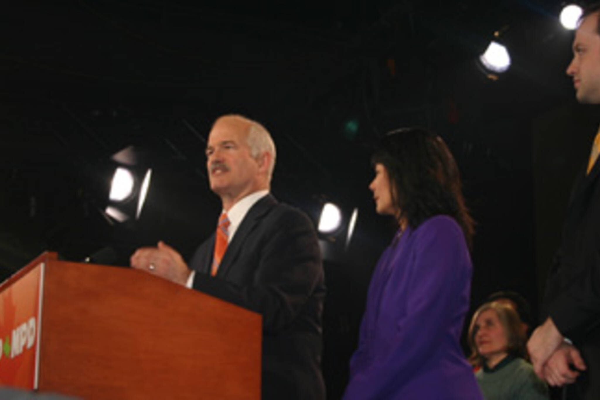 Jack Layton, with wife Olivia Chow and son, tell the crowd what they want to hear