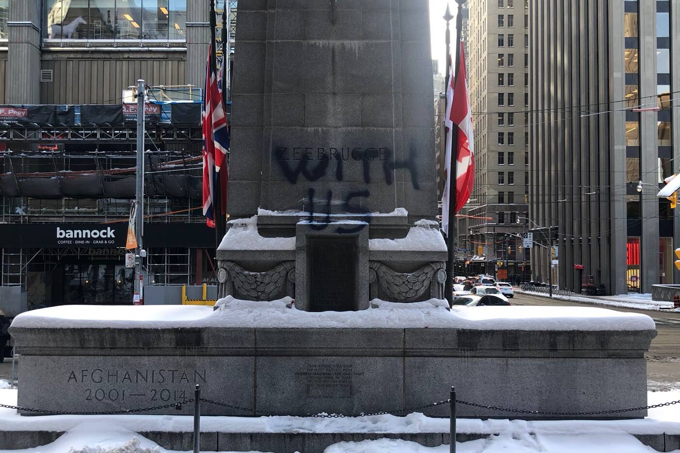 One of two phrases spray painted on the Old City Hall Cenotaph