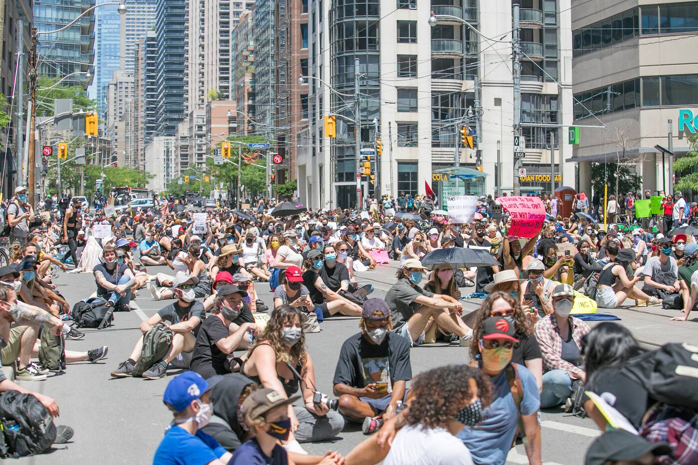 Protesters stage sitin outside Toronto Police headquarters in support